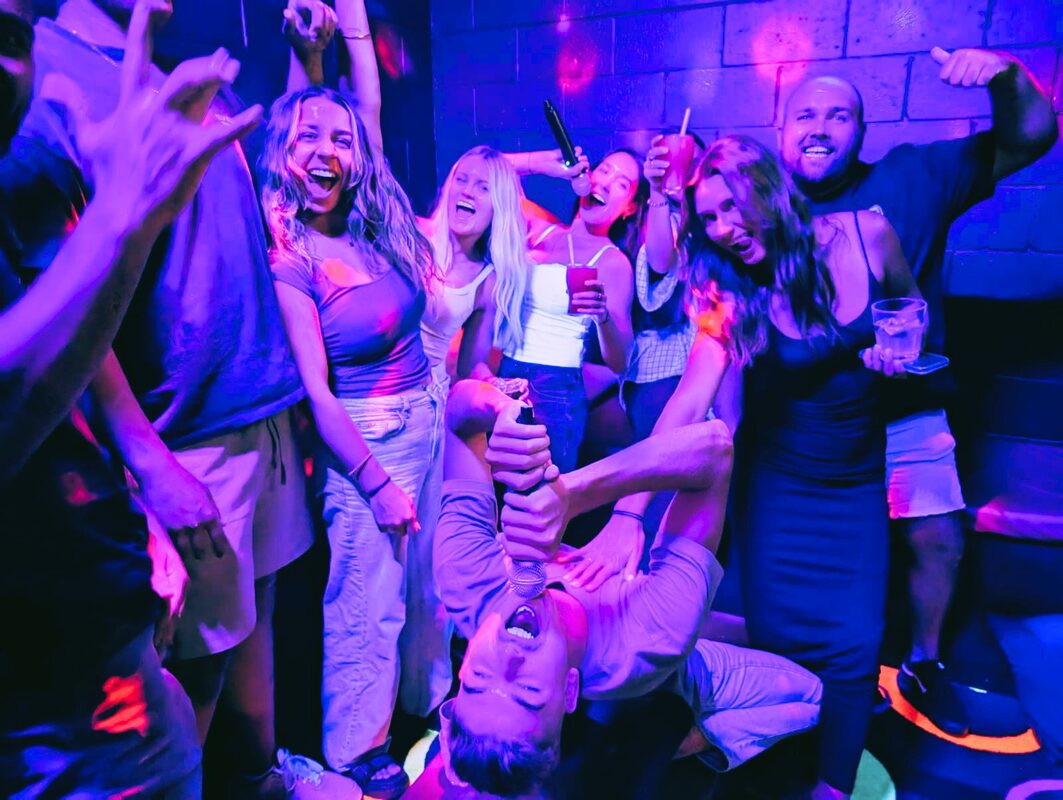 Group celebrating a birthday in the karaoke room at Spinners