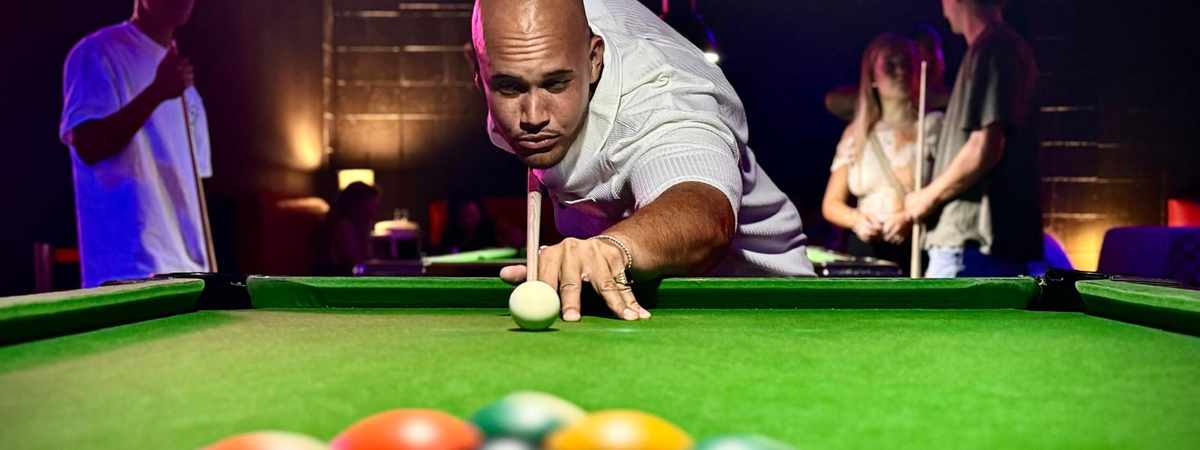 Pool player lining up a shot at Spinners Bar and Bowl Maroochydore